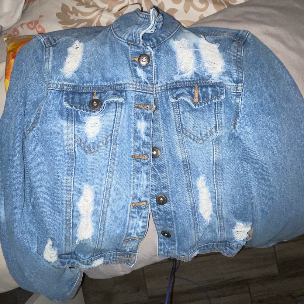Distressed blue jean jacket